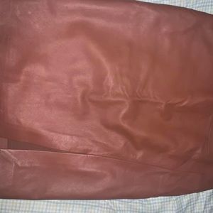 Brown real leather pencil skirt. Brand new, tags still on. Size 0-2.